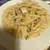 A plate of lemon cream basil pasta with chicken.