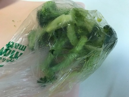 Broccoli in a plastic bag.
