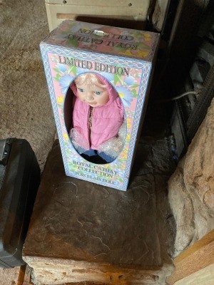 A decorative doll in the original box.
