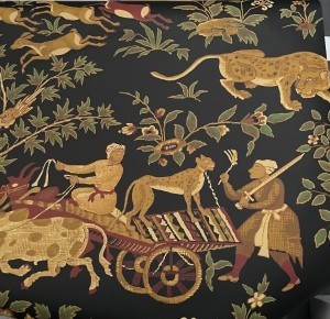 Decorative black paper with a cart and animals.