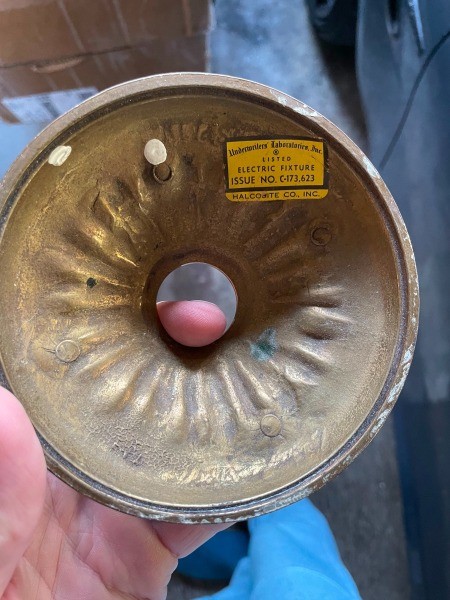 The bottom of a chandelier base.