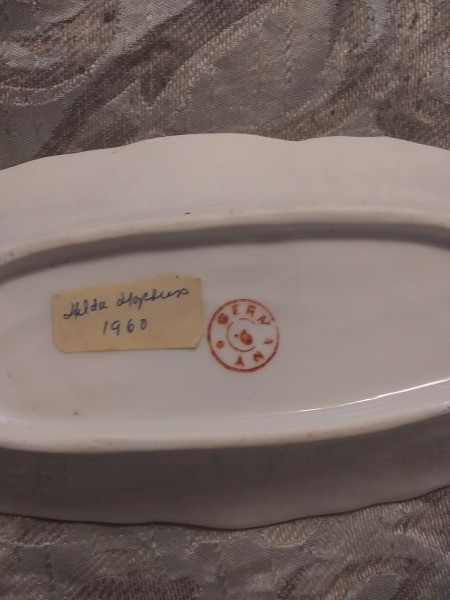 The back of a china butter dish.