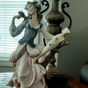 Value of a G. Armani Figurine? - woman in long dress holding a tall, narrow vase or jug