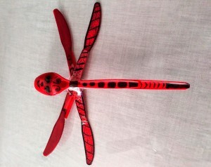 A plastic dragonfly with black markings.