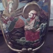 The side of a decorative Japanese vase.