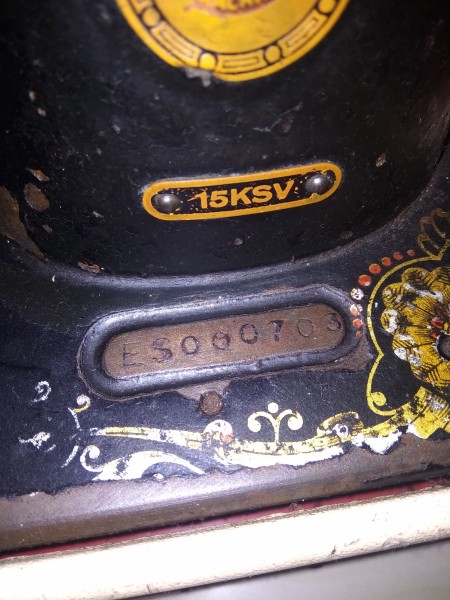 The markings on an old sewing machine.