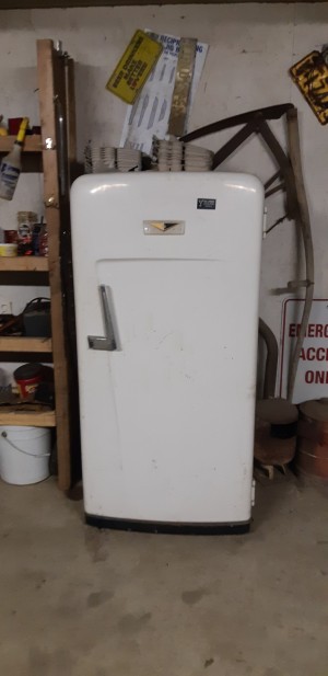 An old white refrigerator.