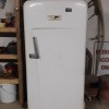 An old white refrigerator.