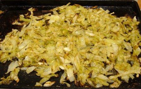 Roasted cabbage on a baking sheet.
