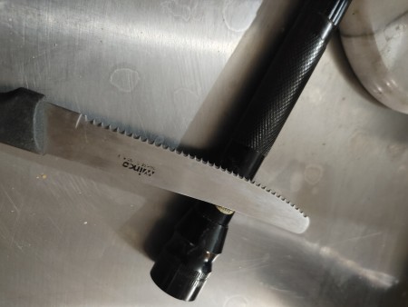 A knife next to a stick shift.