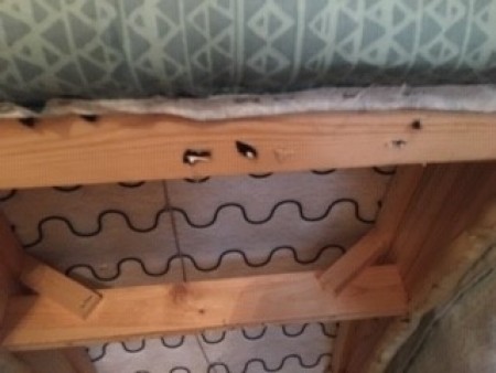 Attaching fabric to the bottom of the chaise lounge.