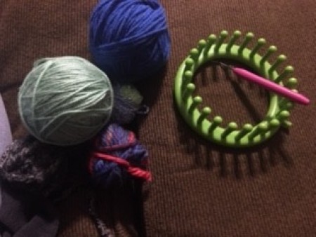 Supplies for making a yarn hat.