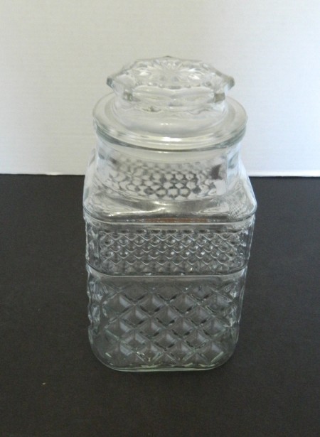 A square glass patterned jar.
