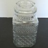 A square glass patterned jar.