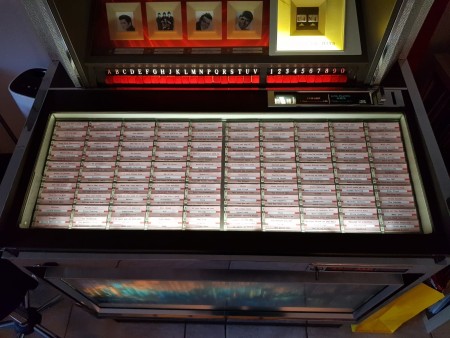 A jukebox with the tracks listed.