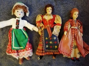 Several different dolls in traditional costumes.