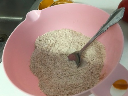 Mixing the dry ingredients together.