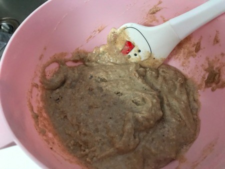 Mixing up the batter in a bowl.