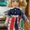 A doll with red, white and blue clothing.