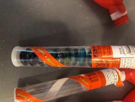 Filling tubes with rocks for weight.