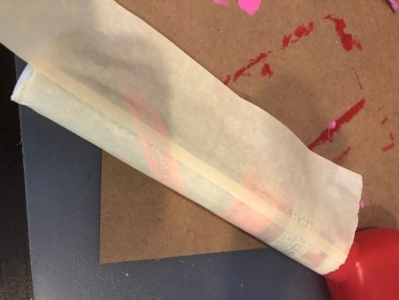 Covering the tubes in masking tape.