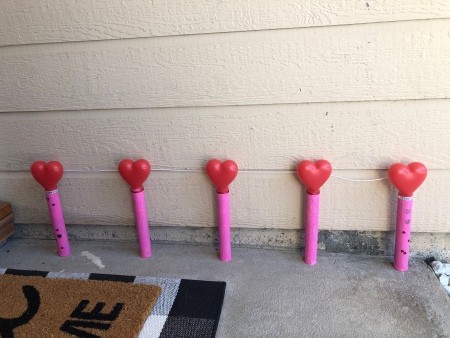 A row of valentine tubes against a wall.