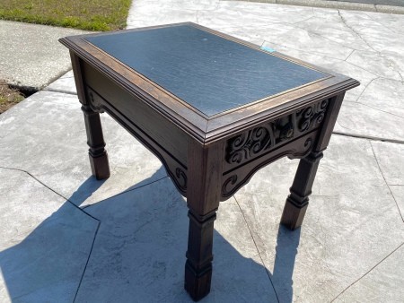 A leather topped side table.