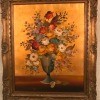 An old fashioned painting of flowers.
