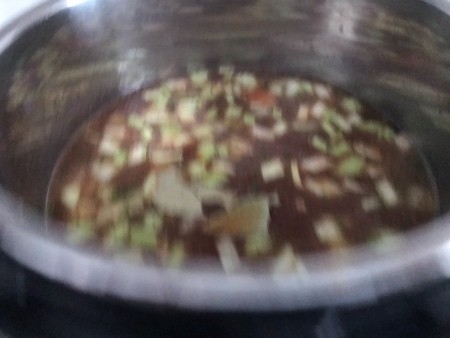 Adding all the ingredients to the pot.