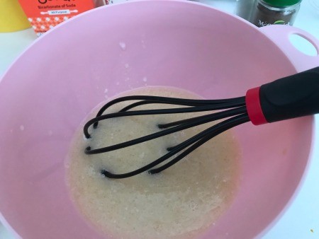 Whisking the batter in a bowl.