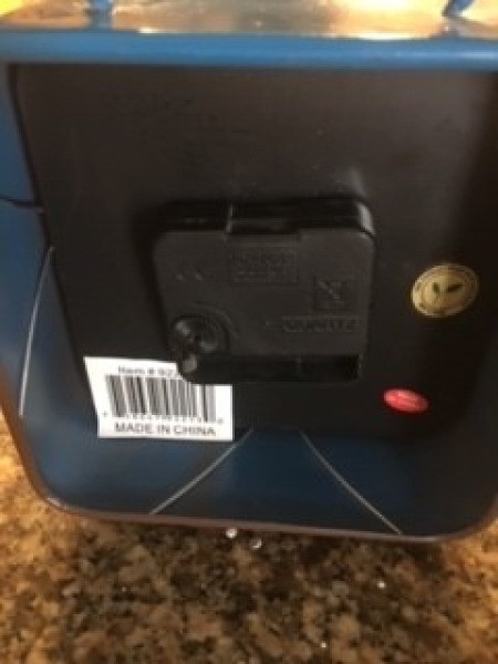 The back of a decorative clock.