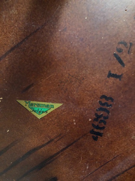 The Mersman marking on the underside of a table.
