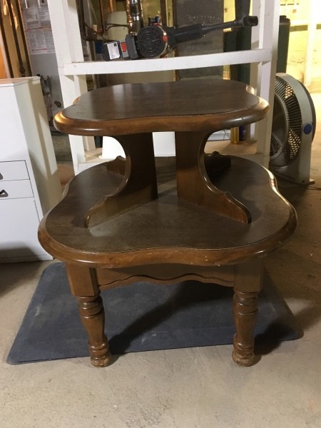 A Mersman table with a smaller table attached to the top.