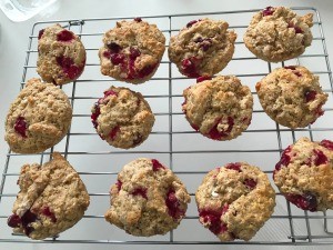 Fresh baked muffins on a cooling rack.