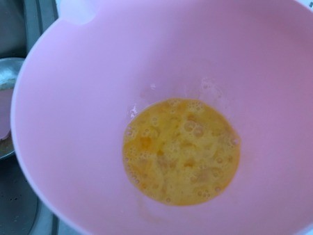 Eggs scrambled in a bowl.
