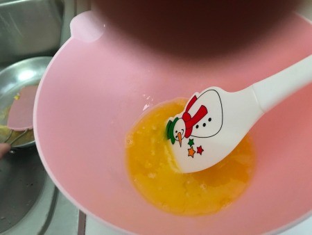 Eggs scrambled in a bowl.