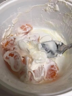 Mandarin oranges mixed with whipped cream for an easy dessert.
