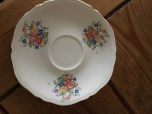 A floral pattern on a china saucer.
