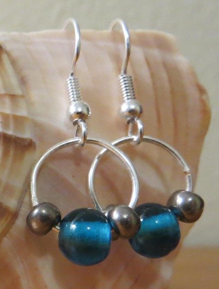 Two bead and wire earrings.
