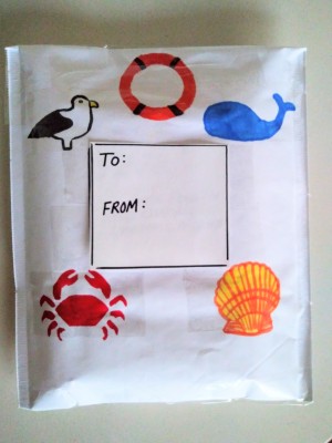A decorated bubble mailer with designs from the sea.