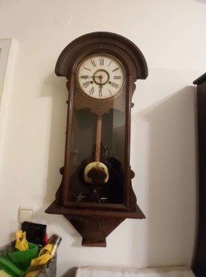 A vintage wooden wall clock.