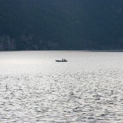 A boat on a lake at twilight.