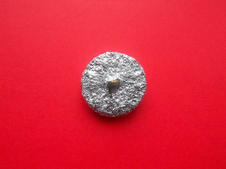 Making Shank Buttons the Cheap Way Using Concrete - foil wrapped around button