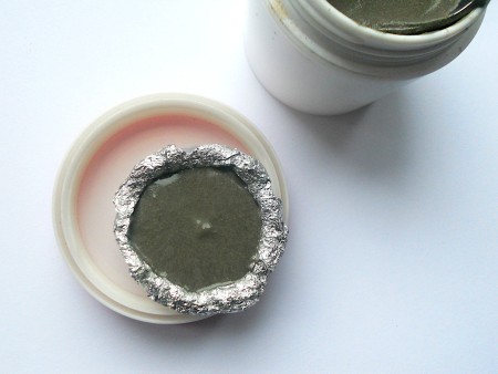 Making Shank Buttons the Cheap Way Using Concrete - add cement to lubricated mold, shake to level