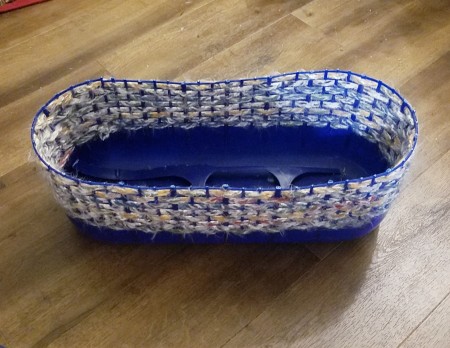The cut down crocheted plastic basket.