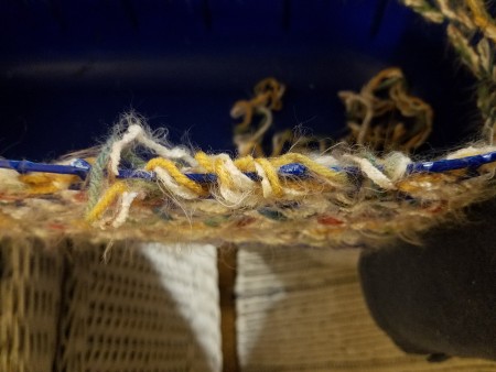 Repairing the top of the basket.