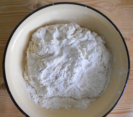 Making the pizza dough in a bowl.