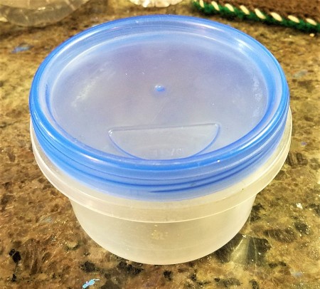 A small plastic container.