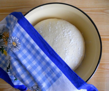 Covering the dough with a towel.