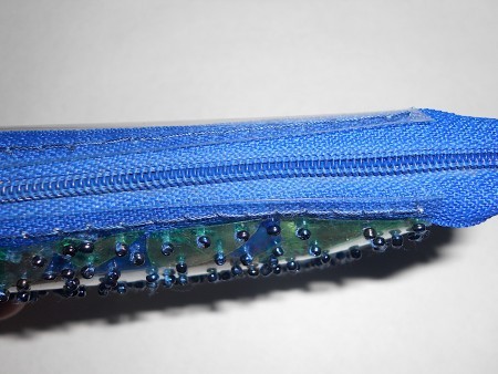 Attaching the zipper to the pouch.